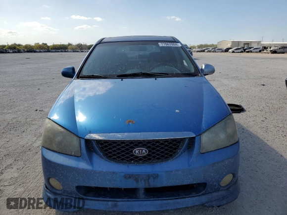 2005 Kia Spectra with VIN KNAFE161555082073, listed as a Copart auction lot 77062804 with 173,387 mi miles and Salvage Title. Bid and sale history available at DreamBid. Image 5.
