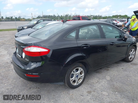 2015 Ford Fiesta SE with VIN 3FADP4BJ5FM130099, listed as a IAAI auction lot 42126960 with 82,299 mi miles and . Bid and sale history available at DreamBid. Image 4.