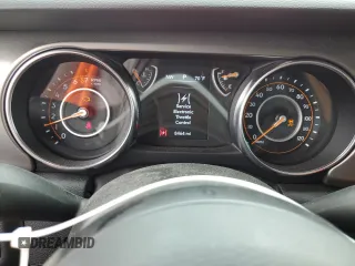 2023 Jeep Gladiator Sport S with VIN 1C6HJTAG4PL547608, listed as a Copart auction lot 52566245 with 8,464 mi miles and Salvage title. Bid and sale history available at DreamBid. Image 9.