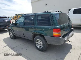 1996 Jeep Grand Cherokee Laredo z VIN 1J4GZ58S8TC222435, wystawiony jako Copart lot #62347665 z przebiegiem 202 125 mil mil oraz Czysty tytuł • Clean title. Historia ofert i sprzedaży dostępna na DreamBid. Obrazek 2.