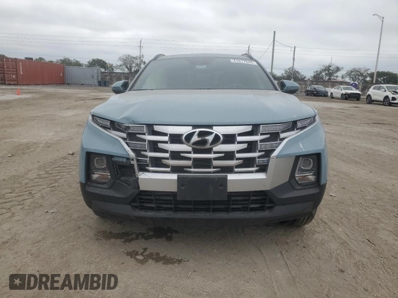 2023 Hyundai Santa Cruz SEL z VIN 5NTJC4AE4PH043025, wystawiony jako Copart lot #41617645 z przebiegiem Nie podano mil oraz Nie do naprawy • Non repairable. Historia ofert i sprzedaży dostępna na DreamBid. Obrazek 5.