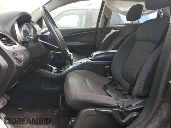 2013 Dodge Journey American Value with VIN 3C4PDCAB6DT709996, listed as a Copart auction lot 52362635 with 104,808 mi miles and Salvage Title. Bid and sale history available at DreamBid. Image 7.