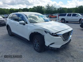 2022 Mazda CX-9 Touring with VIN JM3TCBCY7N0600787, listed as a IAAI auction lot 42240512 with 27,927 mi miles and . Bid and sale history available at DreamBid. Image 1.