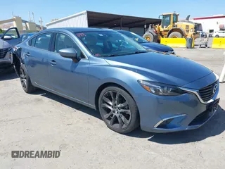 2016 Mazda 6 i Grand Touring с VIN JM1GJ1W57G1460149, выставлен на аукционе IAAI как лот 42349661 с пробегом 71 231 миль миль и . История ставок и продаж доступна на DreamBid. Изображение 1.