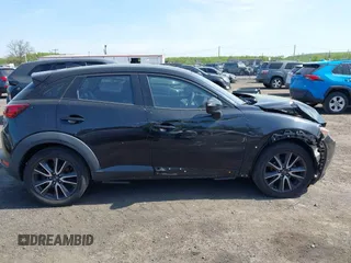 2018 Mazda CX-3 Touring z VIN JM1DKDC70J0329410, wystawiony jako IAAI lot #42137391 z przebiegiem 86 013 mil mil oraz . Historia ofert i sprzedaży dostępna na DreamBid. Obrazek 13.