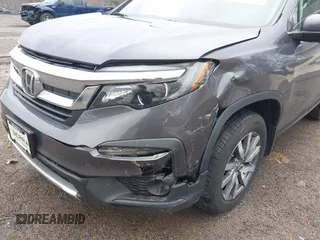 2020 Honda Pilot EX-L z VIN 5FNYF6H53LB059294, wystawiony jako IAAI lot #41910511 z przebiegiem 55 737 mil mil oraz . Historia ofert i sprzedaży dostępna na DreamBid. Obrazek 6.