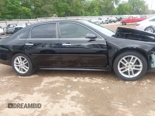 2014 Chevrolet Impala LTZ with VIN 2G1WC5E36E1138809, listed as a IAAI auction lot 41961255 with 119,222 mi miles and . Bid and sale history available at DreamBid. Image 14.