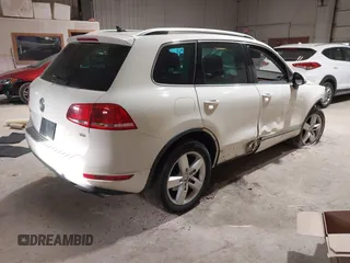 2011 Volkswagen Touareg Sport with VIN WVGFF9BP8BD004747, listed as a IAAI auction lot 41780515 with 159,228 mi miles and . Bid and sale history available at DreamBid. Image 4.