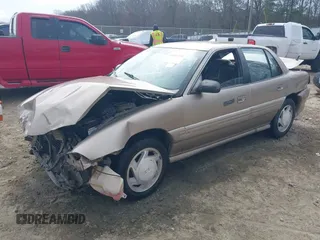 1997 Pontiac Grand Am SE with VIN 1G2NE52T1VC761092, listed as a IAAI auction lot 41547391 with 297,392 mi miles. Bid and sale history available at carsss.com. Image 2.