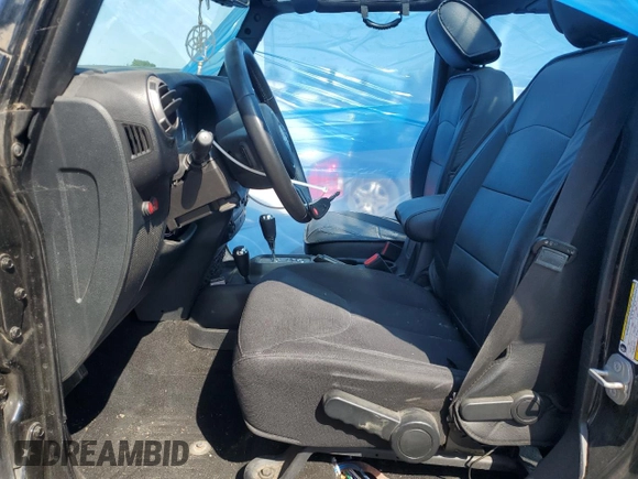 2015 Jeep Wrangler Unlimited Freedom with VIN 1C4BJWDG8FL689194, listed as a Copart auction lot 58016385 with 108,026 mi miles and Salvage title. Bid and sale history available at DreamBid. Image 7.