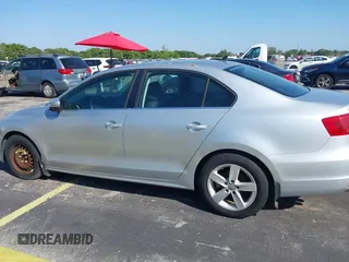 2013 Volkswagen Jetta TDI w/Premium with VIN 3VWLL7AJ0DM385077, listed as a IAAI auction lot 42322406 with 63,428 mi miles and . Bid and sale history available at DreamBid. Image 6.