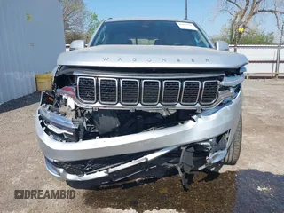 2022 Jeep Wagoneer Series III z VIN 1C4SJVDT4NS144766, wystawiony jako IAAI lot #42013510 z przebiegiem 18 954 mil mil oraz . Historia ofert i sprzedaży dostępna na DreamBid. Obrazek 6.