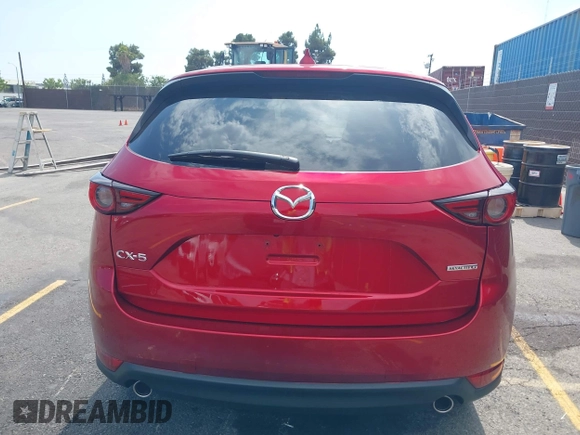 2021 Mazda CX-5 Grand Touring with VIN JM3KFADM6M1373111, listed as a IAAI auction lot 42784431 with 14,374 mi miles and . Bid and sale history available at DreamBid. Image 16.