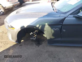 2023 Ford Mustang GT Premium z VIN 1FATP8FF0P5107393, wystawiony jako IAAI lot #41279324 z przebiegiem 26 622 mil mil oraz . Historia ofert i sprzedaży dostępna na DreamBid. Obrazek 6.