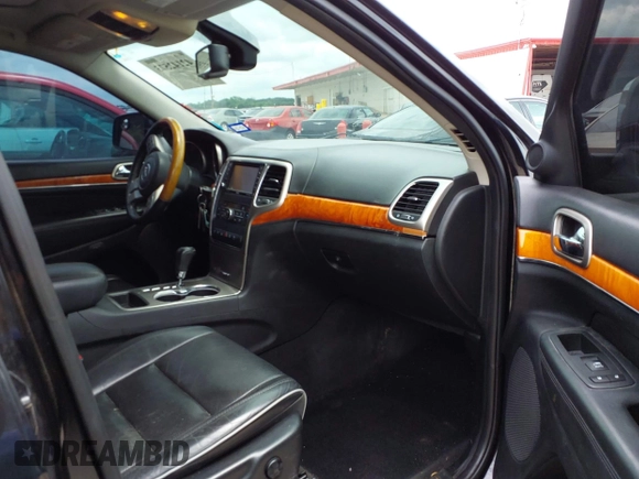 2013 Jeep Grand Cherokee Overland with VIN 1C4RJECT2DC588124, listed as a IAAI auction lot 42142573 with 204,309 mi miles and . Bid and sale history available at DreamBid. Image 5.
