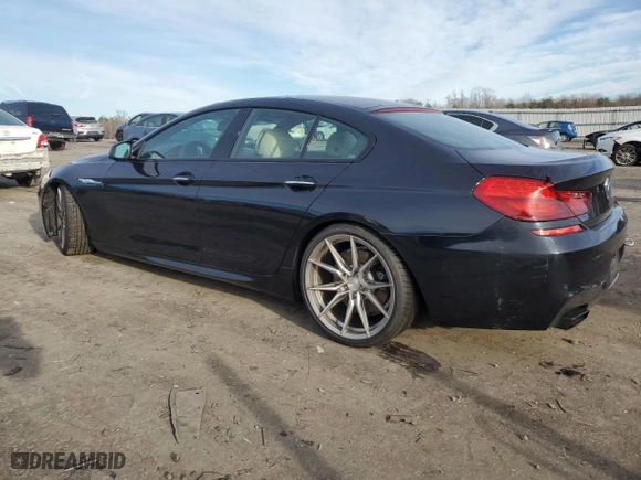 2014 BMW 6 Series 650i with VIN WBA6B2C51ED128896, listed as a Copart auction lot 84801734 with 142,181 mi miles and Salvage Title. Bid and sale history available at carsss.com. Image 2.