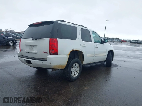 2011 GMC Yukon SLT with VIN 1GKS2CE03BR118690, listed as a IAAI auction lot 41941840 with 243,311 mi miles and . Bid and sale history available at DreamBid. Image 4.