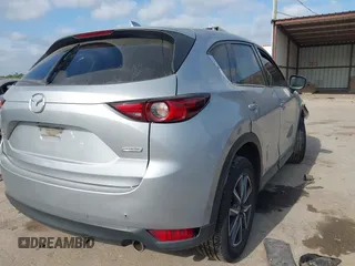 2018 Mazda CX-5 Grand Touring with VIN JM3KFADM6J0325626, listed as a IAAI auction lot 42054702 with 121,952 mi miles and . Bid and sale history available at DreamBid. Image 4.
