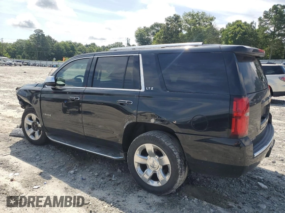 2015 Chevrolet Tahoe LTZ with VIN 1GNSCCKC2FR693500, listed as a Copart auction lot 60225195 with 206,210 mi miles and Salvage title. Bid and sale history available at DreamBid. Image 2.