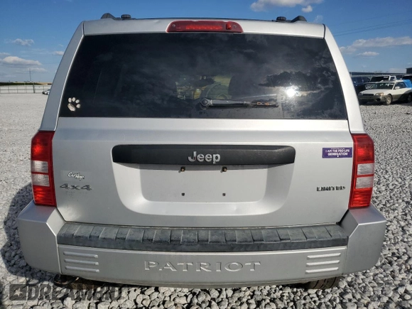 2009 Jeep Patriot with VIN 1J8FF48B49D221606, listed as a Copart auction lot 49596465 with 168,305 mi miles and Salvage title. Bid and sale history available at DreamBid. Image 6.