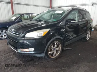 2015 Ford Escape Titanium with VIN 1FMCU9J98FUB00525, listed as a IAAI auction lot 42547989 with 194,040 mi miles and . Bid and sale history available at DreamBid. Image 2.