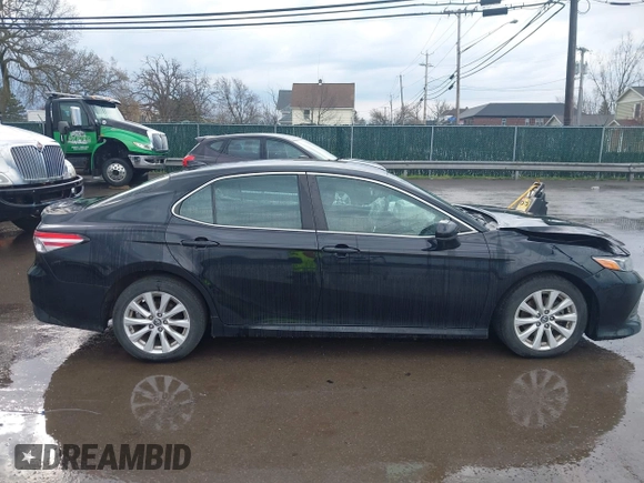 2019 Toyota Camry LE with VIN 4T1B11HK2KU263910, listed as a IAAI auction lot 42060008 with 31,433 mi miles and . Bid and sale history available at DreamBid. Image 13.