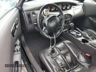 1999 Plymouth Prowler z VIN 1P3EW65G7XV503356, wystawiony jako Copart lot #74829624 z przebiegiem Nie podano mil oraz Nie do naprawy. Historia ofert i sprzedaży dostępna na DreamBid. Obrazek 8.
