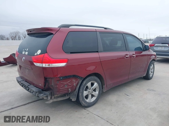 2014 Toyota Sienna LE AAS with VIN 5TDKK3DC6ES487962, listed as a IAAI auction lot 41568458 with 164,043 mi miles. Bid and sale history available at carsss.com. Image 4.