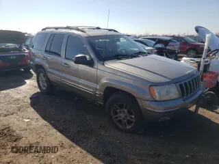 1999 Jeep Grand Cherokee Limited with VIN 1J4GW68N8XC770353, listed as a Copart auction lot 74670614 with Not provided miles and Non repairable. Bid and sale history available at DreamBid. Image 4.