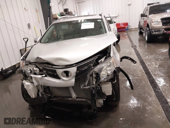 2014 Toyota RAV4 XLE with VIN JTMRFREV5ED052819, listed as a IAAI auction lot 42014672 with 235,481 mi miles and . Bid and sale history available at DreamBid. Image 13.