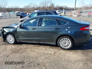 2015 Ford Fusion S Hybrid with VIN 3FA6P0UU7FR117785, listed as a IAAI auction lot 41589546 with 136,657 mi miles. Bid and sale history available at carsss.com. Image 14.