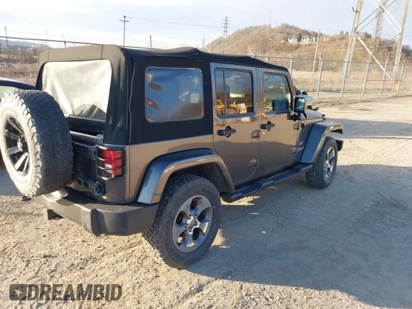 2017 Jeep Wrangler Unlimited Sahara with VIN 1C4BJWEG9HL507908, listed as a IAAI auction lot 41880209 with 99,773 mi miles. Bid and sale history available at carsss.com. Image 4.