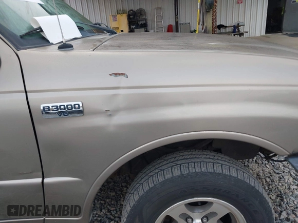 2003 Mazda B-Series 2WD Truck SE with VIN 4F4YR46VX3TM16294, listed as a IAAI auction lot 42034107 with 165,007 mi miles. Bid and sale history available at carsss.com. Image 13.
