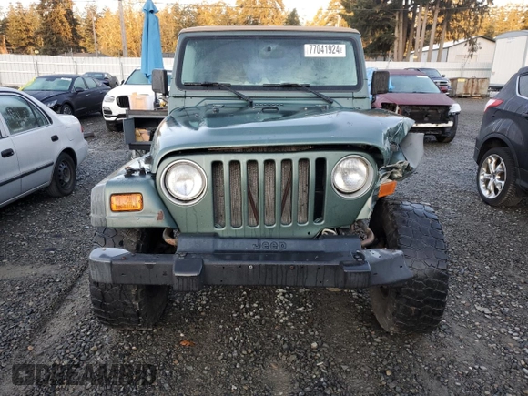 2000 Jeep Wrangler Sport with VIN 1J4FA49S1YP748529, listed as a Copart auction lot 77041924 with 154,949 mi miles and Salvage Title. Bid and sale history available at carsss.com. Image 5.