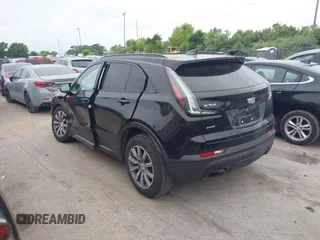 2019 Cadillac XT4 AWD Sport z VIN 1GYFZFR48KF197731, wystawiony jako IAAI lot #42668639 z przebiegiem 73 170 mil mil oraz . Historia ofert i sprzedaży dostępna na DreamBid. Obrazek 3.
