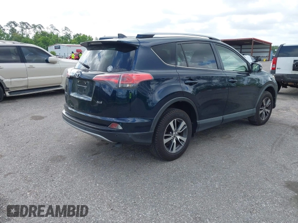 2018 Toyota RAV4 XLE with VIN JTMWFREV9JJ165655, listed as a IAAI auction lot 42138998 with 123,569 mi miles and . Bid and sale history available at carsss.com. Image 4.