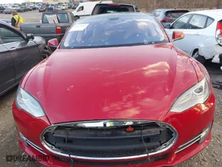2013 Tesla Model S with VIN 5YJSA1DNXDFP27901, listed as a IAAI auction lot 41823006 with 106,595 mi miles. Bid and sale history available at carsss.com. Image 12.
