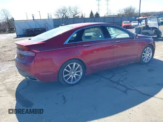 2015 Lincoln MKZ Hybrid with VIN 3LN6L2LUXFR606101, listed as a IAAI auction lot 41668806 with 77,112 mi miles. Bid and sale history available at carsss.com. Image 4.