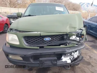 1997 Ford F-150 XL with VIN 1FTDX1861VKA60604, listed as a IAAI auction lot 41060909 with 269,715 mi miles. Bid and sale history available at carsss.com. Image 12.