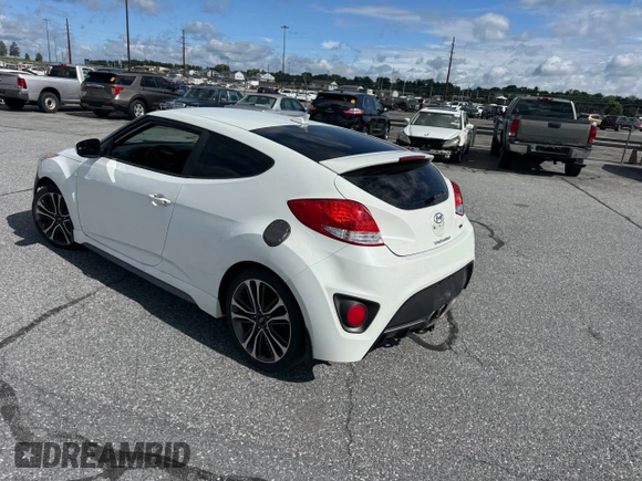 2016 Hyundai Veloster Turbo z VIN KMHTC6AE3GU296034, wystawiony jako Copart lot #59438335 z przebiegiem 121 565 mil mil oraz Czysty tytuł • Clean title. Historia ofert i sprzedaży dostępna na DreamBid. Obrazek 3.