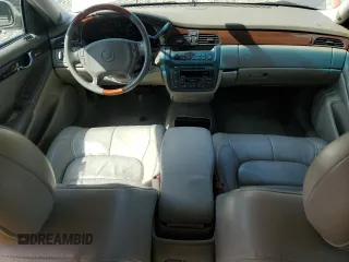2002 Cadillac DeVille DHS z VIN 1G6KE57Y32U107755, wystawiony jako Copart lot #52811235 z przebiegiem 111 141 mil mil oraz Nie do naprawy. Historia ofert i sprzedaży dostępna na DreamBid. Obrazek 8.