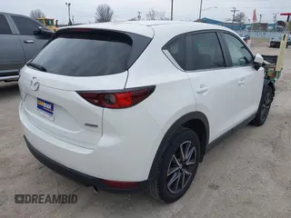 2018 Mazda CX-5 Touring z VIN JM3KFBCM6J0323107, wystawiony jako IAAI lot #41895519 z przebiegiem 86 124 mil mil oraz . Historia ofert i sprzedaży dostępna na DreamBid. Obrazek 4.