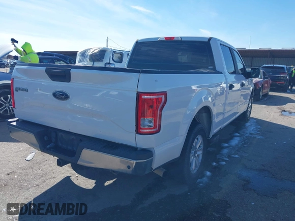 2015 Ford F-150 XL with VIN 1FTEW1CG5FFA61157, listed as a IAAI auction lot 41299436 with 145,310 mi miles. Bid and sale history available at carsss.com. Image 4.