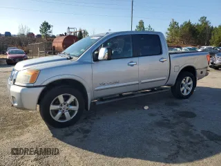 2011 Nissan Titan Pro-4X z VIN 1N6AA0EC1BN301383, wystawiony jako Copart lot #86963124 z przebiegiem 146 393 mil mil oraz Tytuł czysty. Historia ofert i sprzedaży dostępna na DreamBid. Obrazek 1.