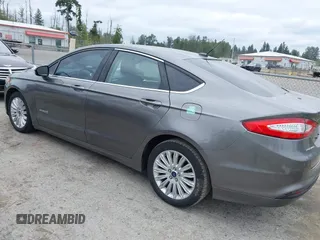 2014 Ford Fusion SE Hybrid with VIN 3FA6P0LU6ER285188, listed as a IAAI auction lot 42516215 with 122,899 mi miles and . Bid and sale history available at DreamBid. Image 3.