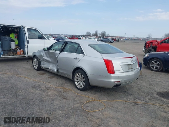 2014 Cadillac CTS Luxury AWD z VIN 1G6AX5SX2E0196881, wystawiony jako IAAI lot #41707633 z przebiegiem 169 168 mil mil oraz . Historia ofert i sprzedaży dostępna na DreamBid. Obrazek 3.