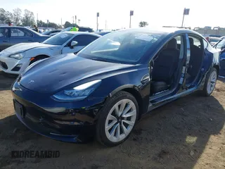 2022 Tesla Model 3 with VIN 5YJ3E1EA9NF295890, listed as a IAAI auction lot 41175917 with 42,230 mi miles and . Bid and sale history available at DreamBid. Image 24.