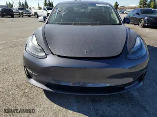 2021 Tesla Model 3 Standard Range Plus with VIN 5YJ3E1EA9MF872920, listed as a Copart auction lot 83625474 with 62,507 mi miles and Salvage Title. Bid and sale history available at carsss.com. Image 5.