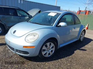 2010 Volkswagen New Beetle Coupe with VIN 3VWRW3AG2AM018644, listed as a IAAI auction lot 41815380 with 99,738 mi miles. Bid and sale history available at carsss.com. Image 2.