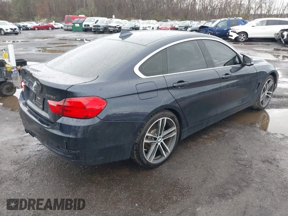 2016 BMW 4 Series 428i xDrive with VIN WBA4C9C59GG137067, listed as a IAAI auction lot 41913733 with 104,378 mi miles and . Bid and sale history available at carsss.com. Image 4.